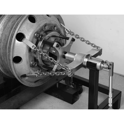 wheel puller shown attached to hgv wheel hub using chain system ad 12t ram to pull