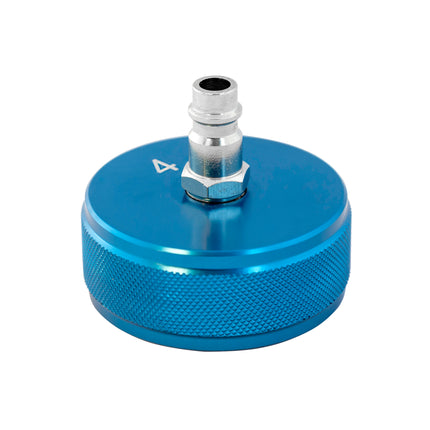 A blue metal cooling system cap with a textured surface marked no 4.