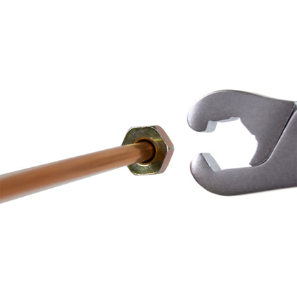 lockjaw wrench next to a nut on the end of a length of pipe